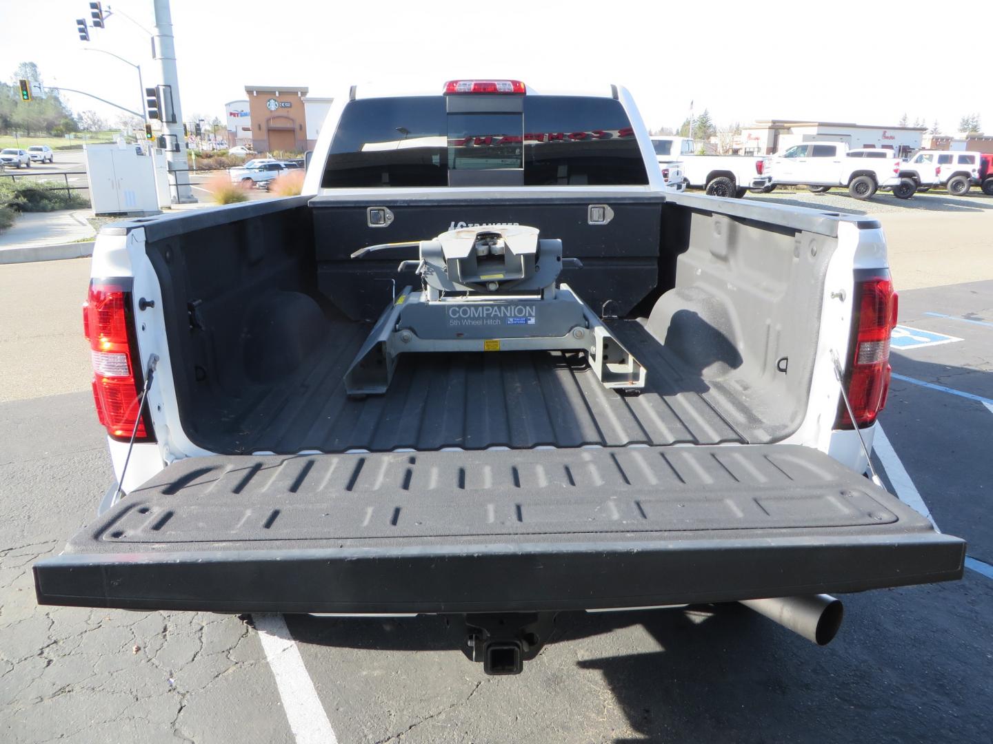 2015 White GMC Sierra 2500 HD Crew Cab Denali (1GT120E88FF) with an V8 Turbo Dsl 6.6L engine, Auto 6-Spd Allison OD transmission, located at 2630 Grass Valley Highway, Auburn, CA, 95603, (530) 508-5100, 38.937893, -121.095482 - 2015 GMC Denali 2500 6.6L Duramax Diesel. Cognito 4-6" lift kit, Cognito traction bars, Cognito idler and pitman support, Kryptonite upper control arms, Fox remote reservoir shocks, Amp power steps, Fuel Offroad wheels, Nitto Ridge Grappler tires, Alpine Stereo Firestone ride rite air bags, Transfer - Photo#12